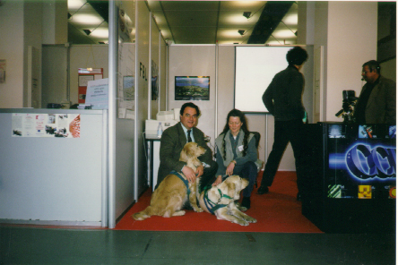 Two dogs, Debra and Giuliano at an exhibition stand