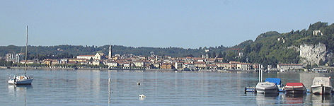 A few boats and a small village on the Major Lake's shore